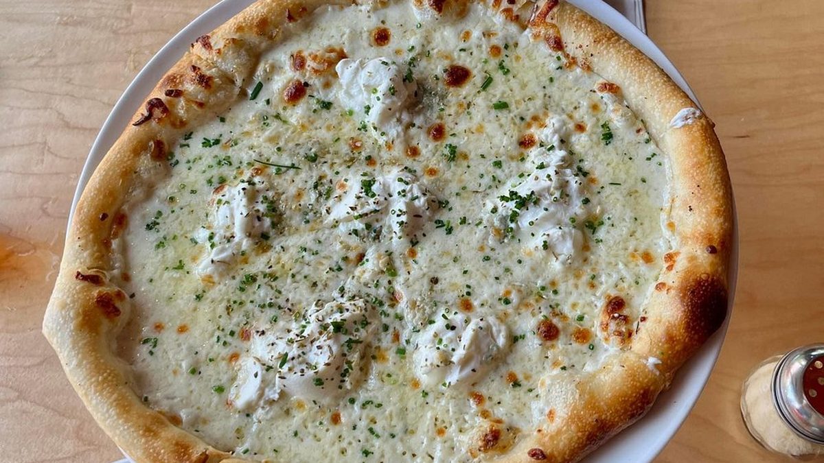 White pizza at Skybox Taphouse Waikiki — fresh mozzarella, parmesan, and garlic cream sauce